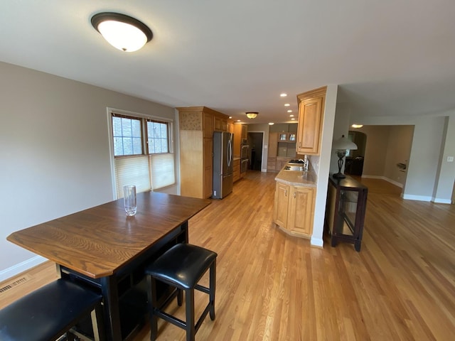 10724 S Ridgeway Ave, Chicago, IL 60655 - kitchen with freestanding refrigerator, a sink, baseboards, and light wood-type flooring