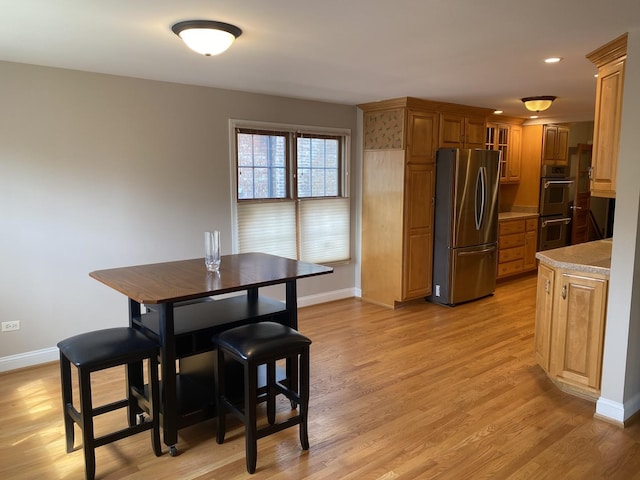 10724 S Ridgeway Ave, Chicago, IL 60655 - dining space featuring baseboards and light wood-style flooring