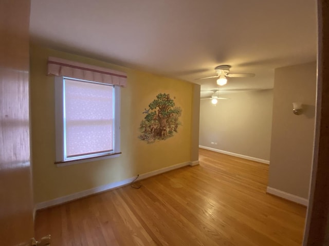 10724 S Ridgeway Ave, Chicago, IL 60655 - spare room featuring light wood finished floors, a ceiling fan, and baseboards
