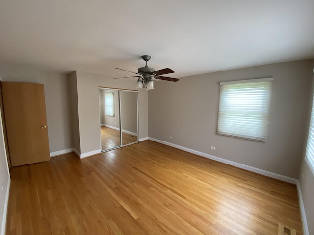 10724 S Ridgeway Ave, Chicago, IL 60655 - unfurnished bedroom with a closet, light wood finished floors, baseboards, and a ceiling fan