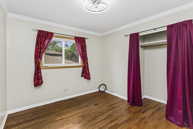 525 N 3rd Ave, Villa Park, IL 60181 - unfurnished bedroom featuring crown molding, wood finished floors, baseboards, and a closet