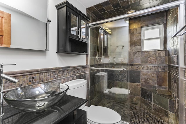 525 N 3rd Ave, Villa Park, IL 60181 - bathroom with tile walls, toilet, a stall shower, and vanity