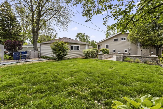 525 N 3rd Ave, Villa Park, IL 60181 - view of grassy yard with an outbuilding