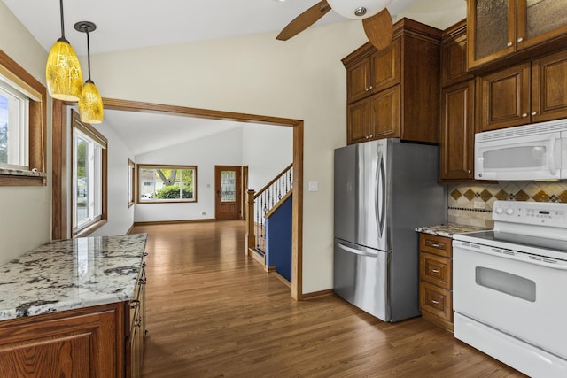 525 N 3rd Ave, Villa Park, IL 60181 - kitchen featuring white appliances, lofted ceiling, dark wood finished floors, decorative backsplash, and a ceiling fan