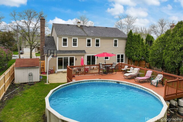 707 W Nichols Rd, Arlington Heights, IL 60004 - back of house with a deck, roof with shingles, a chimney, and outdoor dining space