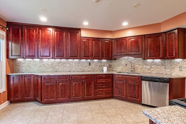79 Willow Pkwy, Buffalo Grove, IL 60089 - kitchen with dishwasher, a sink, dark brown cabinets, light stone countertops, and backsplash