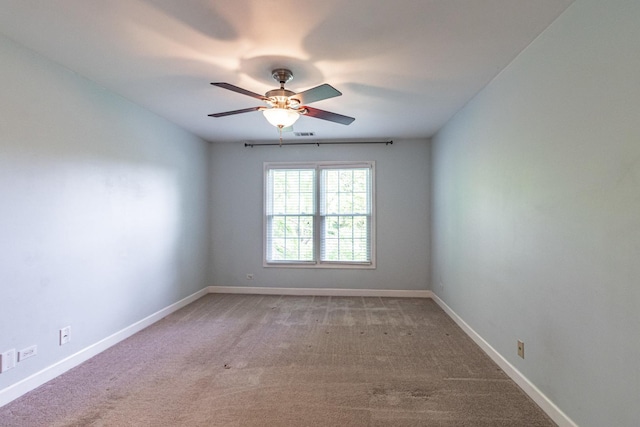79 Willow Pkwy, Buffalo Grove, IL 60089 - spare room with a ceiling fan, light colored carpet, and baseboards