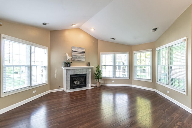 79 Willow Pkwy, Buffalo Grove, IL 60089 - unfurnished living room with lofted ceiling, plenty of natural light, dark wood-type flooring, and a tile fireplace