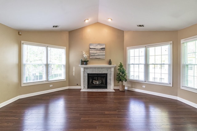 79 Willow Pkwy, Buffalo Grove, IL 60089 - unfurnished living room featuring vaulted ceiling, hardwood / wood-style floors, healthy amount of natural light, and a fireplace