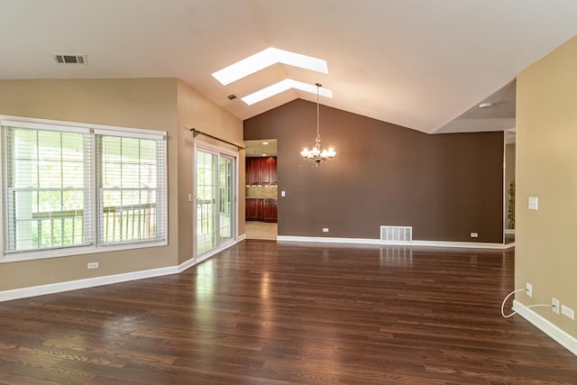 79 Willow Pkwy, Buffalo Grove, IL 60089 - unfurnished living room featuring a chandelier, lofted ceiling, a skylight, healthy amount of natural light, and wood finished floors