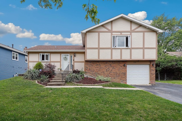 228 Oriole Rd, Matteson, IL 60443 - view of front facade featuring driveway, stucco siding, brick siding, and a front yard