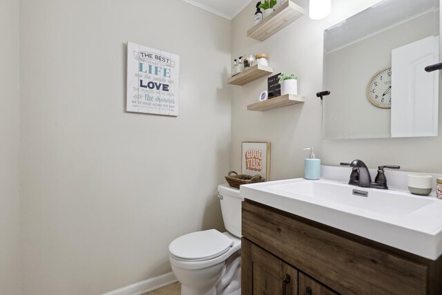 228 Oriole Rd, Matteson, IL 60443 - half bathroom with crown molding, toilet, vanity, and baseboards