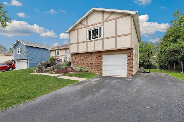 228 Oriole Rd, Matteson, IL 60443 - view of front of house with a garage, stucco siding, brick siding, a front lawn, and asphalt driveway