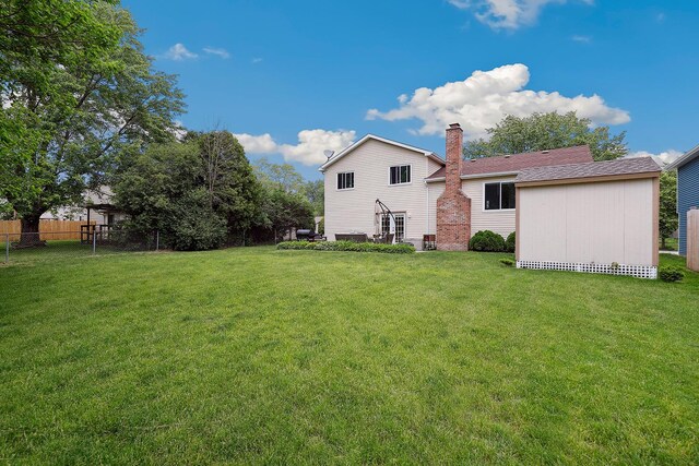 228 Oriole Rd, Matteson, IL 60443 - rear view of property featuring a chimney