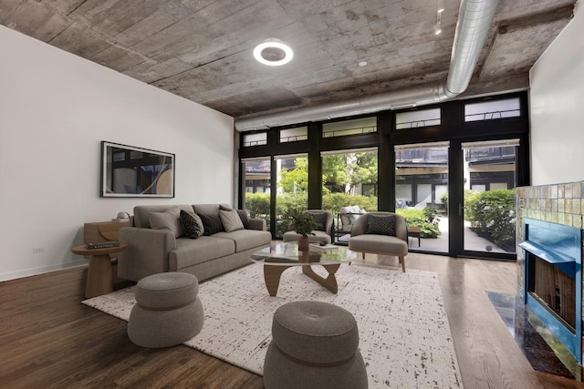 1110 W 15th St Unit 114, Chicago, IL 60608 - living room with wood finished floors, a wall of windows, and baseboards