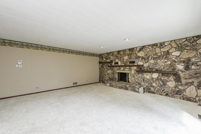 12375 W Ash Ct, Beach Park, IL 60099 - unfurnished living room with a stone fireplace and carpet