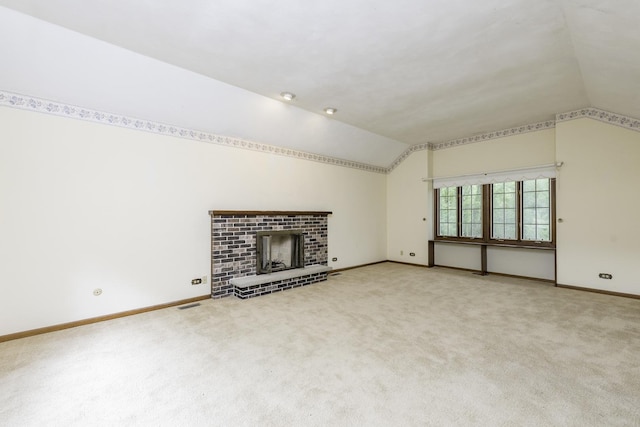 12375 W Ash Ct, Beach Park, IL 60099 - unfurnished living room with lofted ceiling, baseboards, carpet floors, and a fireplace