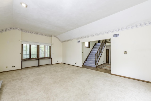 12375 W Ash Ct, Beach Park, IL 60099 - carpeted empty room featuring stairs, lofted ceiling, and baseboards