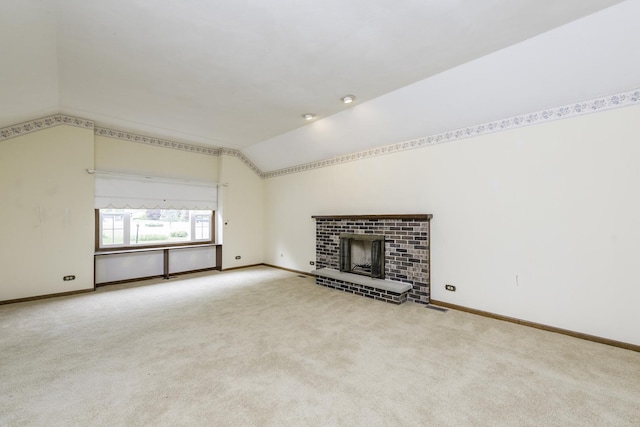 12375 W Ash Ct, Beach Park, IL 60099 - unfurnished living room with vaulted ceiling, carpet flooring, baseboards, and a fireplace