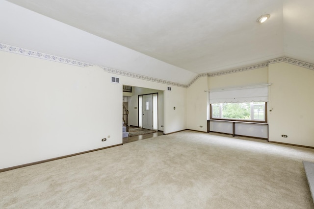 12375 W Ash Ct, Beach Park, IL 60099 - carpeted empty room featuring lofted ceiling and baseboards