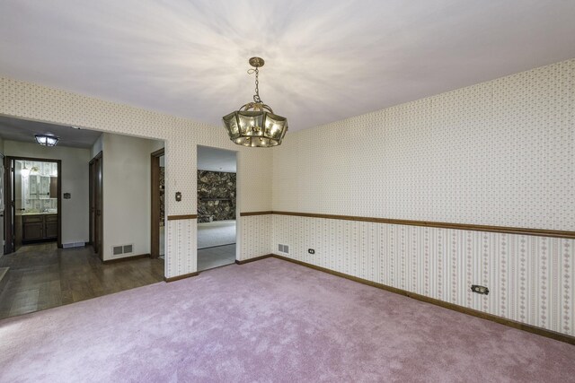 12375 W Ash Ct, Beach Park, IL 60099 - carpeted spare room featuring a chandelier, wallpapered walls, and baseboards