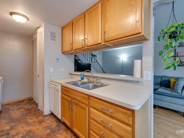 426 James Ct Unit C, Glendale Heights, IL 60139 - kitchen featuring dishwasher, a sink, light countertops, and baseboards