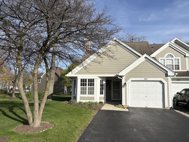 611 Kingsbridge Dr, Carol Stream, IL 60188 - view of front facade with driveway, a front yard, and an attached garage