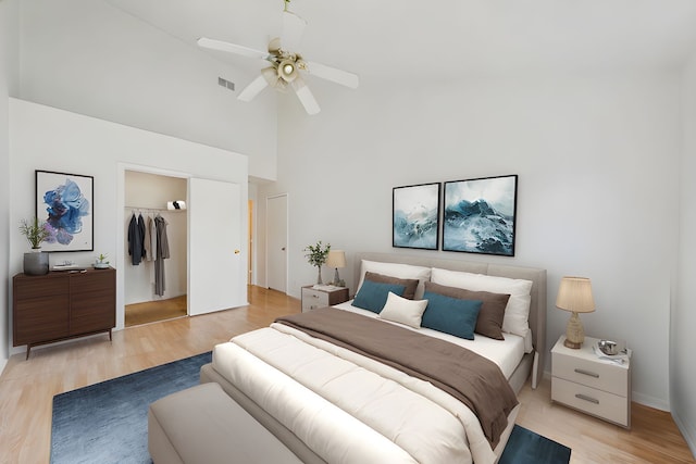 611 Kingsbridge Dr, Carol Stream, IL 60188 - bedroom featuring high vaulted ceiling, a closet, light wood-type flooring, and ceiling fan
