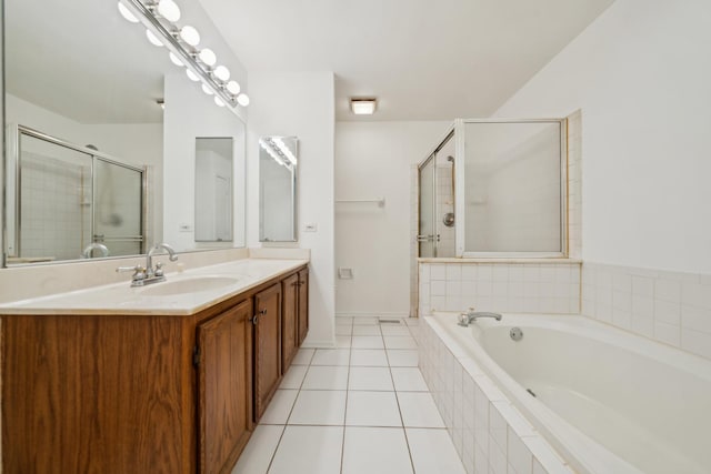 611 Kingsbridge Dr, Carol Stream, IL 60188 - bathroom with vanity, a garden tub, tile patterned flooring, a tile shower, and baseboards