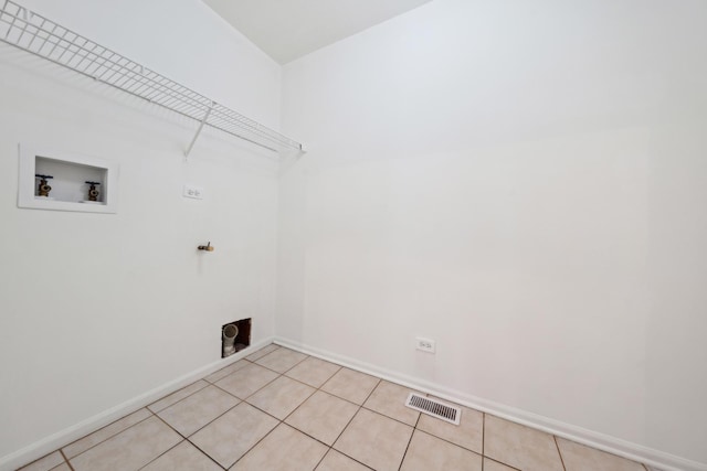 611 Kingsbridge Dr, Carol Stream, IL 60188 - laundry area featuring hookup for a washing machine, hookup for an electric dryer, baseboards, and light tile patterned flooring