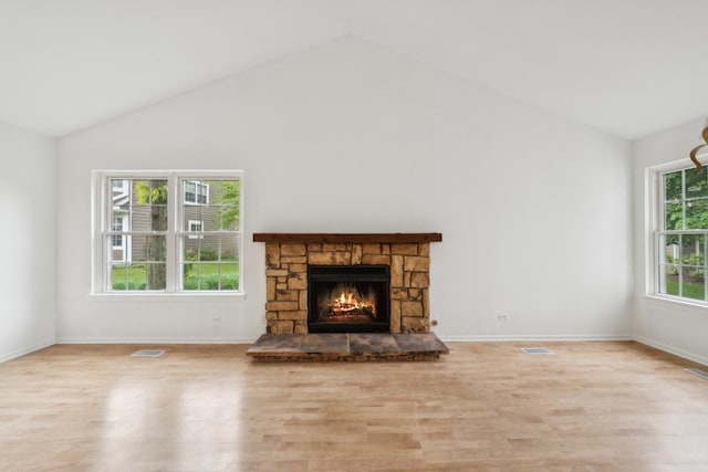 611 Kingsbridge Dr, Carol Stream, IL 60188 - unfurnished living room featuring wood finished floors, high vaulted ceiling, a fireplace, and baseboards