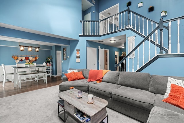 870 N Auburn Woods Dr, Palatine, IL 60067 - living area featuring stairway, a high ceiling, wood finished floors, and carpet floors