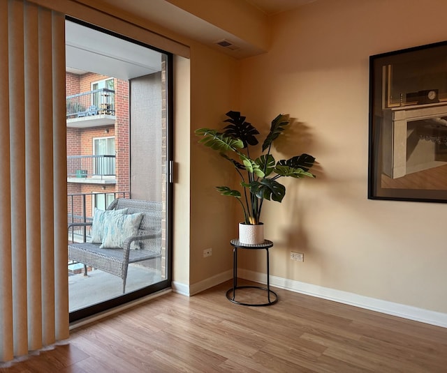 828 Graceland Ave Unit 404, Des Plaines, IL 60016 - doorway featuring wood finished floors and baseboards