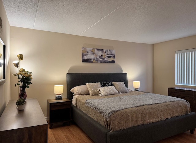 828 Graceland Ave Unit 404, Des Plaines, IL 60016 - bedroom with wood finished floors and a textured ceiling