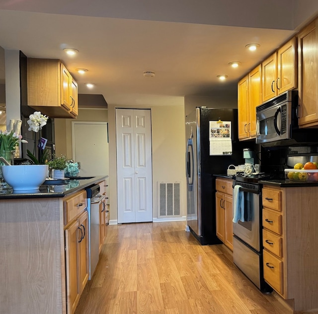 828 Graceland Ave Unit 404, Des Plaines, IL 60016 - kitchen featuring range with electric cooktop, dark countertops, light wood finished floors, freestanding refrigerator, and baseboards