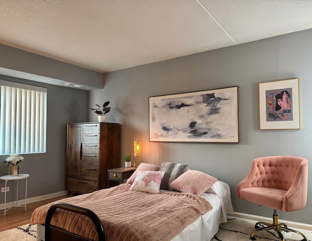 828 Graceland Ave Unit 404, Des Plaines, IL 60016 - bedroom featuring baseboards and wood finished floors