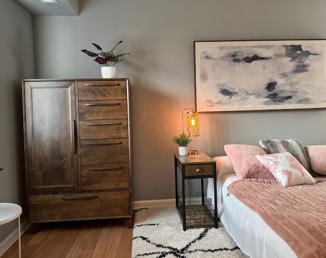 828 Graceland Ave Unit 404, Des Plaines, IL 60016 - bedroom featuring wood finished floors and baseboards