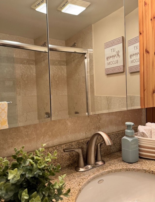 828 Graceland Ave Unit 404, Des Plaines, IL 60016 - bathroom with decorative backsplash, a shower stall, and vanity