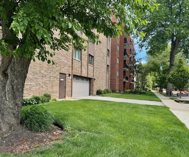828 Graceland Ave Unit 404, Des Plaines, IL 60016 - view of property with concrete driveway and a garage