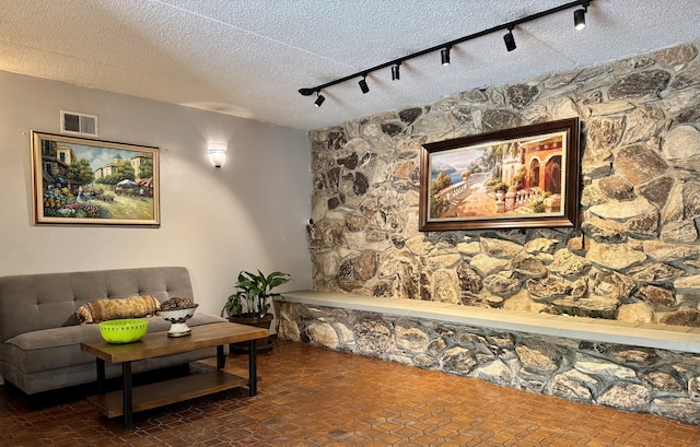 828 Graceland Ave Unit 404, Des Plaines, IL 60016 - living room featuring rail lighting and a textured ceiling