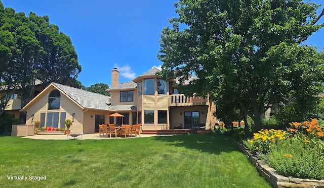 2903 Prairie Meadow Dr, Champaign, IL 61822 - back of property featuring a lawn, a patio area, a chimney, and a balcony