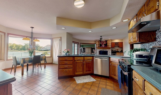 2903 Prairie Meadow Dr, Champaign, IL 61822 - kitchen with dishwasher, under cabinet range hood, decorative backsplash, recessed lighting, and brown cabinetry