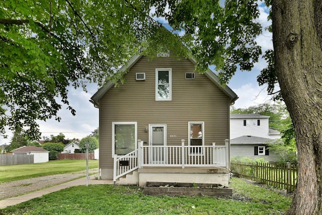 1021 Vine St, Joliet, IL 60435 - back of house featuring a wall mounted air conditioner