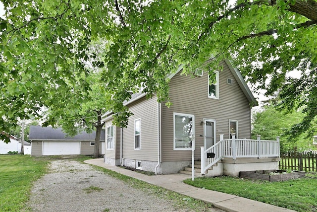 1021 Vine St, Joliet, IL 60435 - view of front facade with a garage