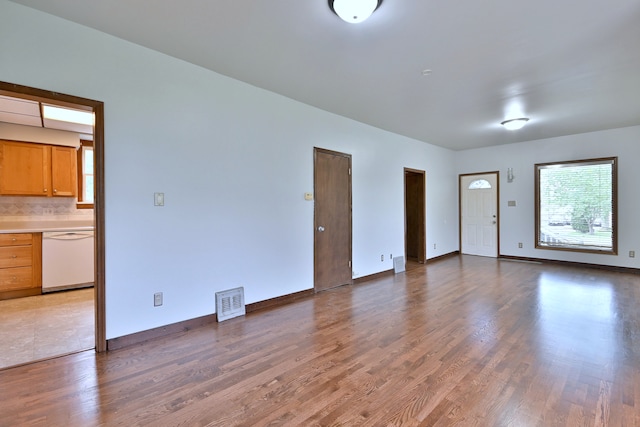 1021 Vine St, Joliet, IL 60435 - unfurnished living room featuring wood finished floors and baseboards