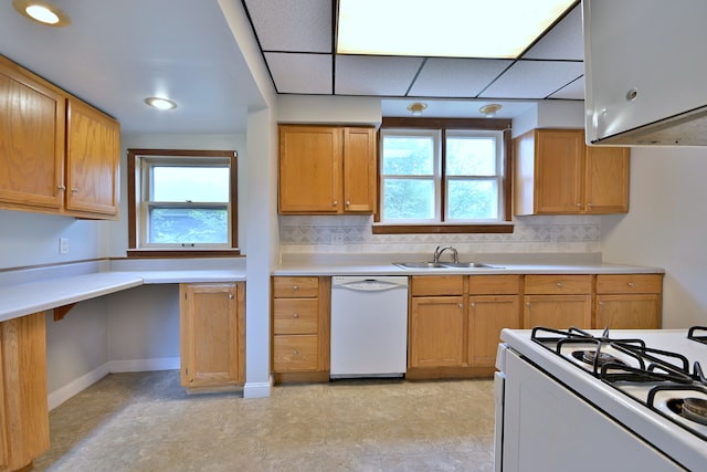 1021 Vine St, Joliet, IL 60435 - kitchen featuring white appliances, a sink, backsplash, and light countertops