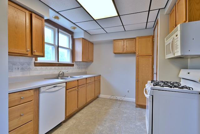 1021 Vine St, Joliet, IL 60435 - kitchen with white appliances, a sink, baseboards, light countertops, and decorative backsplash