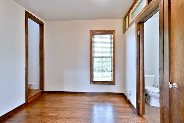 1021 Vine St, Joliet, IL 60435 - unfurnished bedroom with wood finished floors and baseboards