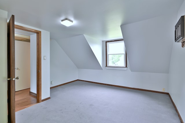 1021 Vine St, Joliet, IL 60435 - additional living space featuring carpet floors, baseboards, and lofted ceiling