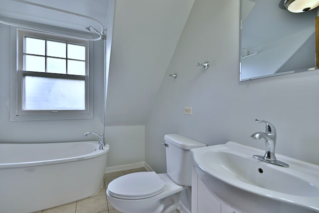 1021 Vine St, Joliet, IL 60435 - bathroom with a soaking tub, toilet, tile patterned floors, vanity, and baseboards